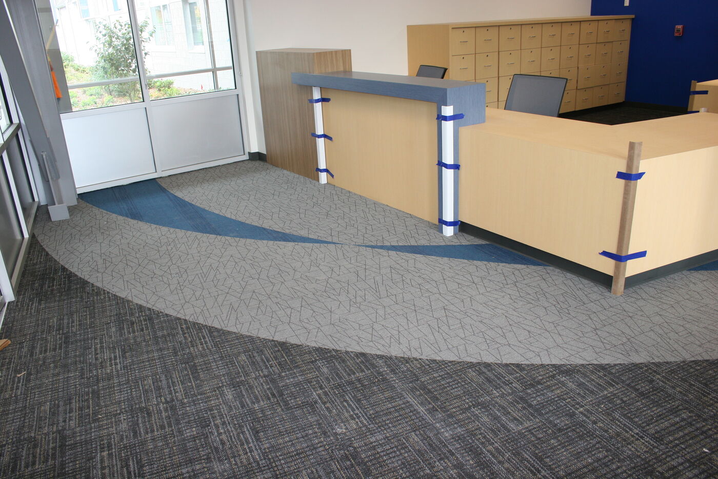 Installed entryway floor with flowing two-tone curves