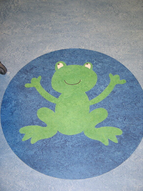 Friendly frog inlaid in a children's hospital floor